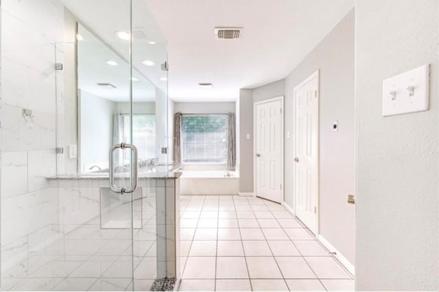 3838 Fawn Creek Dr, Houston, TX 77339 - bathroom with tile patterned flooring, a stall shower, recessed lighting, and a bathtub