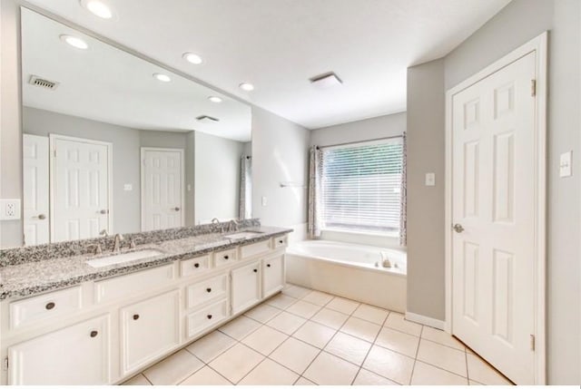 3838 Fawn Creek Dr, Houston, TX 77339 - bathroom with double vanity, a garden tub, recessed lighting, and tile patterned floors
