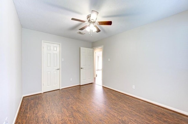 3838 Fawn Creek Dr, Houston, TX 77339 - unfurnished bedroom with wood finished floors, baseboards, and ceiling fan