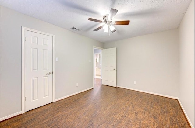 3838 Fawn Creek Dr, Houston, TX 77339 - unfurnished bedroom with wood finished floors, baseboards, and a textured ceiling