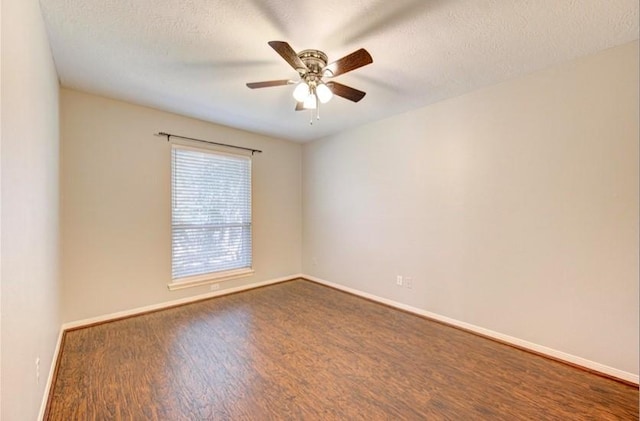3838 Fawn Creek Dr, Houston, TX 77339 - empty room with wood finished floors, a ceiling fan, baseboards, and a textured ceiling