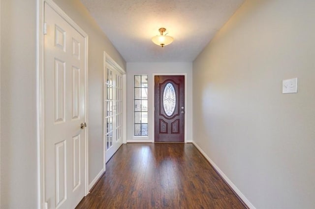 3838 Fawn Creek Dr, Houston, TX 77339 - entrance foyer with dark wood-style floors and baseboards