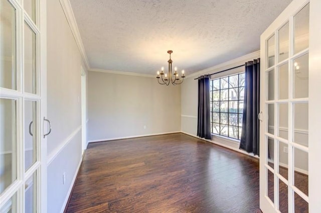 3838 Fawn Creek Dr, Houston, TX 77339 - spare room with ornamental molding, a chandelier, dark wood finished floors, a textured ceiling, and french doors