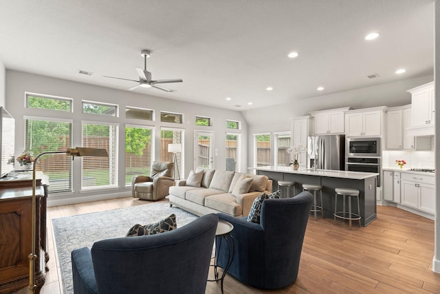 27114 Sofia Forest Dr, Magnolia, TX 77354 - living room featuring ceiling fan, recessed lighting, and light wood finished floors