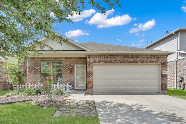 19307 Midnight Glen Dr, Cypress, TX 77429 - view of front of property with driveway, brick siding, an attached garage, and a shingled roof