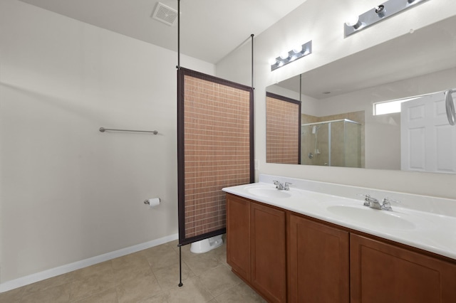 19307 Midnight Glen Dr, Cypress, TX 77429 - full bathroom featuring an enclosed shower, double vanity, tile patterned flooring, and baseboards
