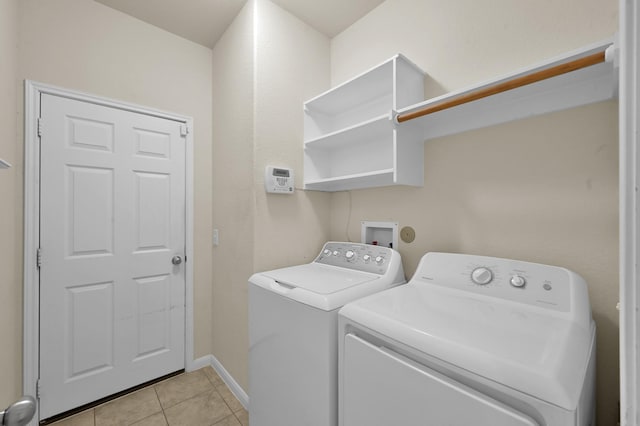 19307 Midnight Glen Dr, Cypress, TX 77429 - laundry area featuring independent washer and dryer, light tile patterned floors, and baseboards