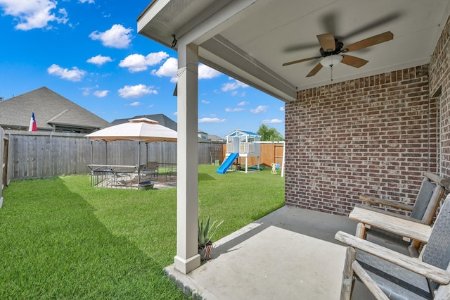 19307 Midnight Glen Dr, Cypress, TX 77429 - view of yard featuring a patio area, a playground, and a ceiling fan