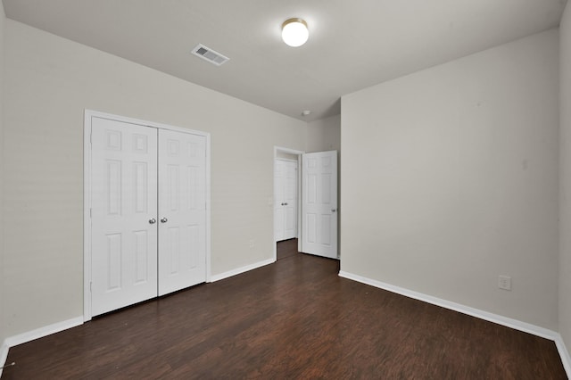 19307 Midnight Glen Dr, Cypress, TX 77429 - unfurnished bedroom featuring dark wood finished floors, baseboards, and a closet