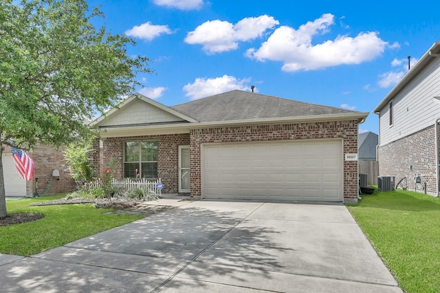19307 Midnight Glen Dr, Cypress, TX 77429 - single story home with brick siding, cooling unit, driveway, and a garage