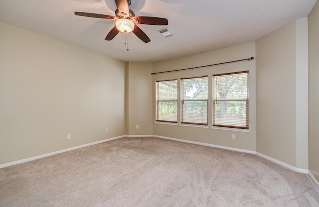 2107 Blue Water Bay Dr, Katy, TX 77494 - unfurnished room featuring light carpet, a ceiling fan, and baseboards