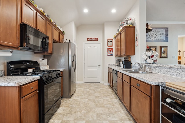 16718 Highland Villa Ln, Humble, TX 77396 - kitchen featuring black appliances, a sink, brown cabinetry, light countertops, and recessed lighting