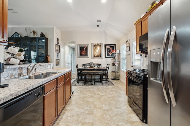 16718 Highland Villa Ln, Humble, TX 77396 - kitchen with black appliances, a sink, brown cabinets, light countertops, and vaulted ceiling