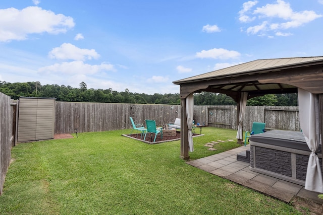 16718 Highland Villa Ln, Humble, TX 77396 - view of yard featuring a gazebo, a fire pit, and a patio