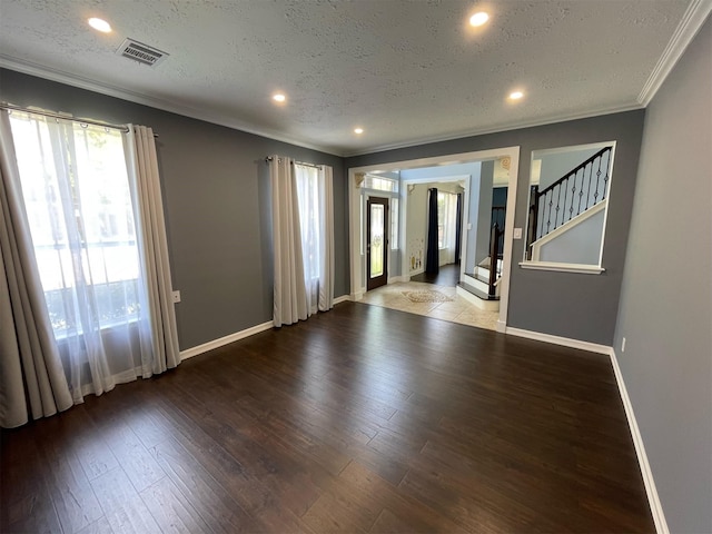 7802 Strathclyde Sound Rd, Houston, TX 77095 - spare room with ornamental molding, baseboards, wood finished floors, a textured ceiling, and stairs