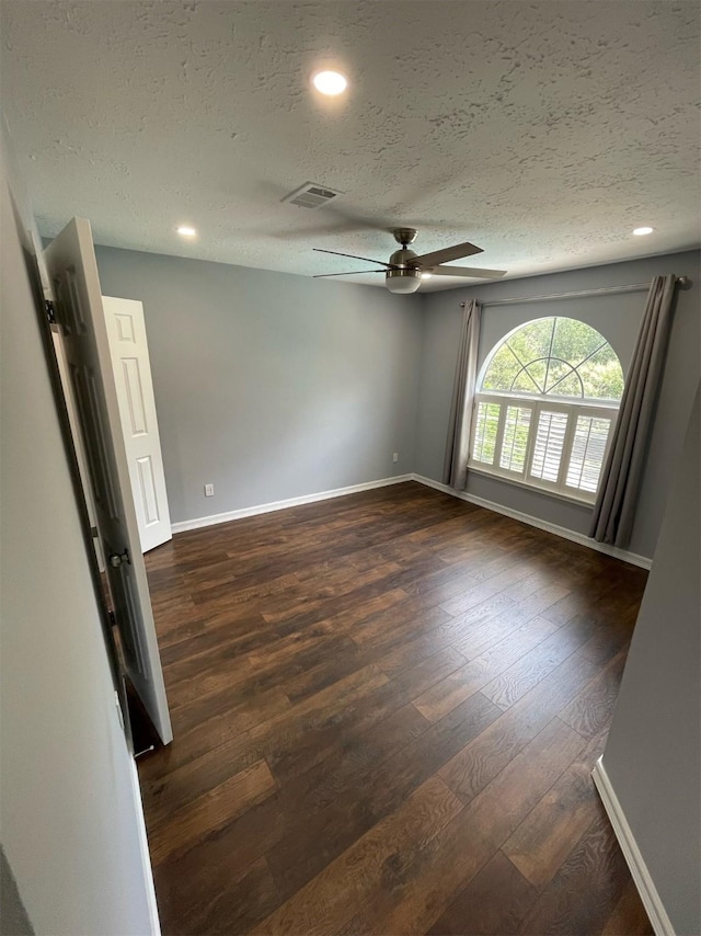 7802 Strathclyde Sound Rd, Houston, TX 77095 - unfurnished room with a textured ceiling, ceiling fan, dark wood-type flooring, baseboards, and recessed lighting