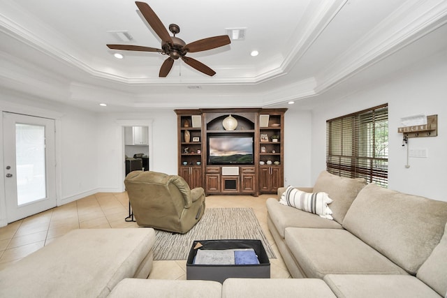 24 Woody Creek Dr, Conroe, TX 77301 - living room with a tray ceiling, light tile patterned floors, ceiling fan, crown molding, and recessed lighting