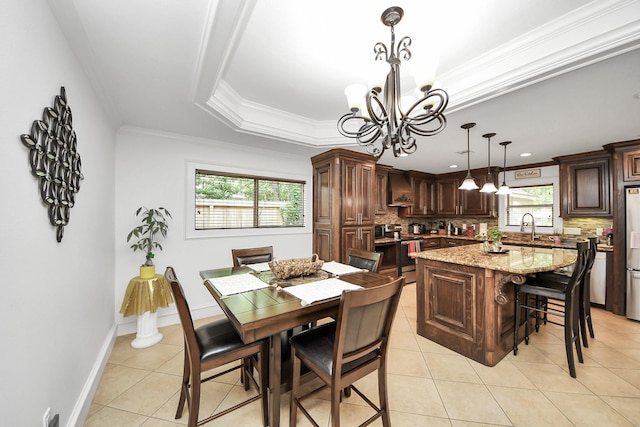 24 Woody Creek Dr, Conroe, TX 77301 - dining area featuring healthy amount of natural light, a chandelier, light tile patterned floors, ornamental molding, and baseboards