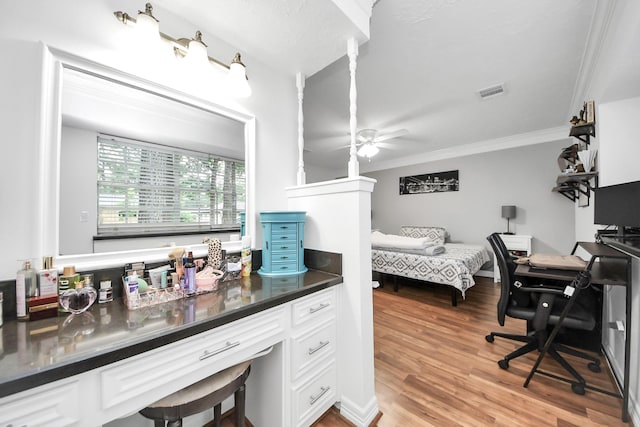 24 Woody Creek Dr, Conroe, TX 77301 - bedroom featuring crown molding, a desk, and light wood finished floors