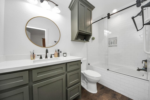 24 Woody Creek Dr, Conroe, TX 77301 - bathroom featuring bathing tub / shower combination, vanity, toilet, and wood finished floors