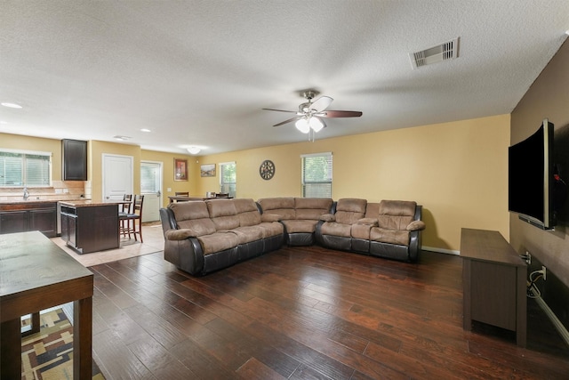 15426 Hope Shadow Ct, Cypress, TX 77429 - living area featuring a ceiling fan, plenty of natural light, hardwood / wood-style floors, and a textured ceiling