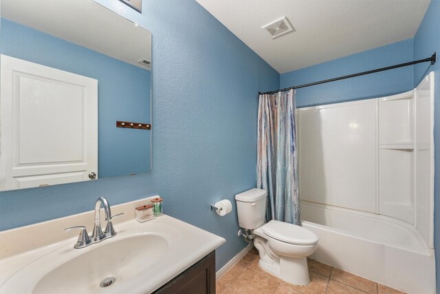 15426 Hope Shadow Ct, Cypress, TX 77429 - bathroom featuring vanity, baseboards, toilet, shower / tub combo with curtain, and a textured wall