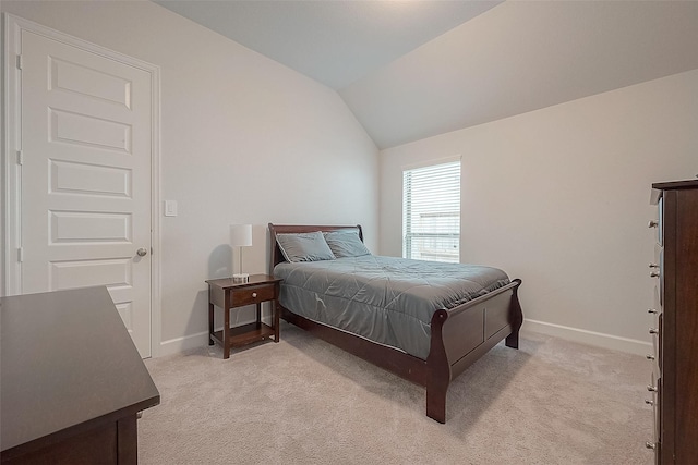 29042 Hauter Way, Fulshear, TX 77441 - bedroom with baseboards, light colored carpet, and vaulted ceiling