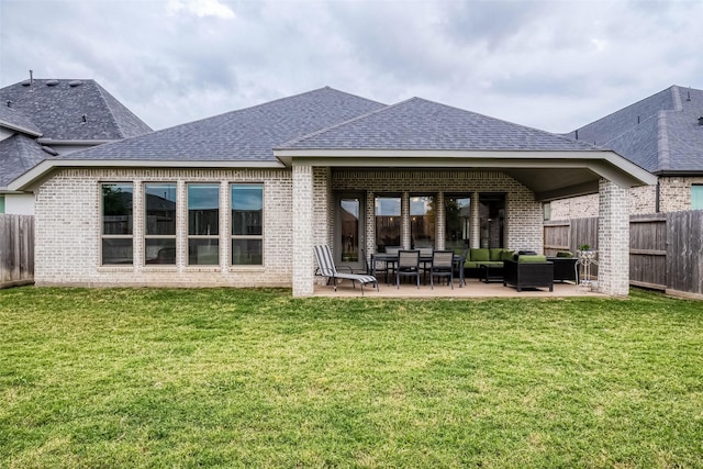 29042 Hauter Way, Fulshear, TX 77441 - back of house featuring a shingled roof, an outdoor living space, a patio area, and brick siding