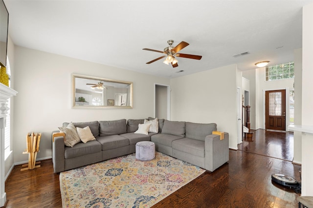 44 Parkway Pl, Houston, TX 77040 - living area with dark wood-type flooring, ceiling fan, a fireplace, and baseboards