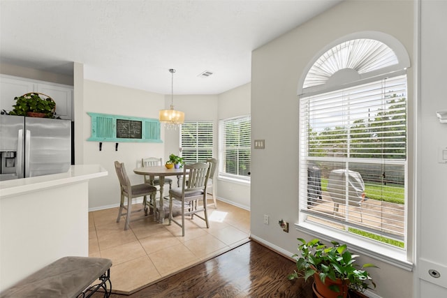 44 Parkway Pl, Houston, TX 77040 - dining space featuring a chandelier, baseboards, and wood finished floors