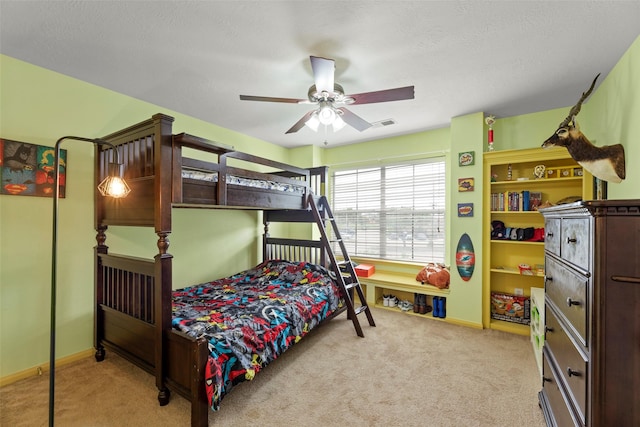44 Parkway Pl, Houston, TX 77040 - bedroom with carpet floors, ceiling fan, baseboards, and a textured ceiling