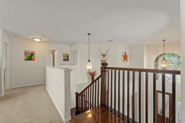 44 Parkway Pl, Houston, TX 77040 - hallway featuring an upstairs landing, attic access, carpet floors, and baseboards