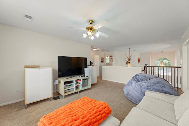 44 Parkway Pl, Houston, TX 77040 - carpeted living room featuring ceiling fan, attic access, and baseboards