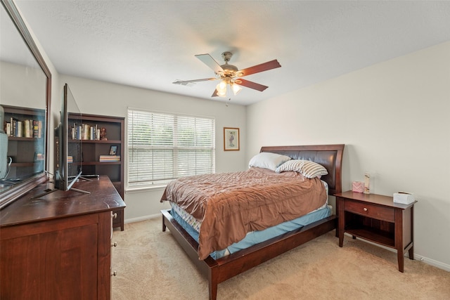44 Parkway Pl, Houston, TX 77040 - bedroom with light colored carpet, baseboards, and ceiling fan