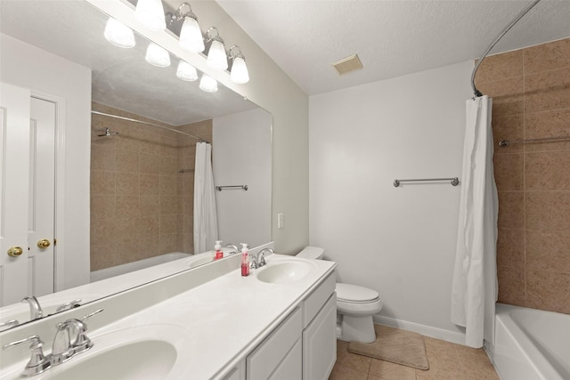 44 Parkway Pl, Houston, TX 77040 - bathroom with shower / tub combo, double vanity, toilet, tile patterned flooring, and a textured ceiling