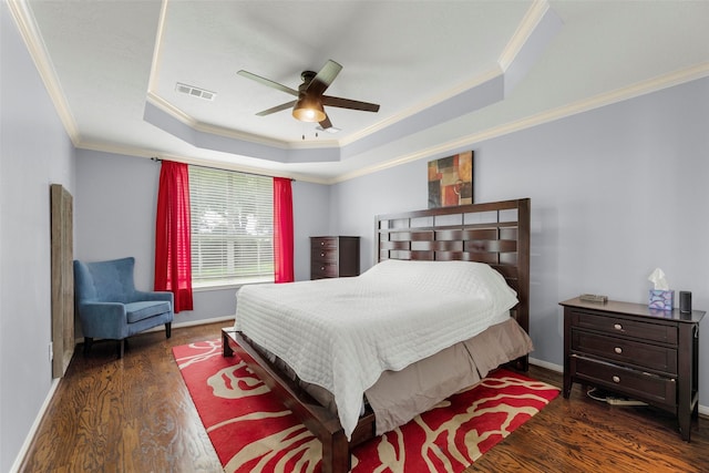 44 Parkway Pl, Houston, TX 77040 - bedroom with ornamental molding, a tray ceiling, wood finished floors, baseboards, and ceiling fan