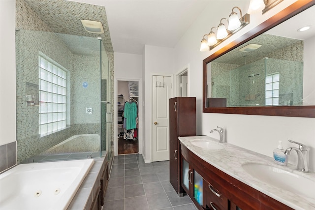 44 Parkway Pl, Houston, TX 77040 - bathroom with a shower stall, tile patterned flooring, a tub with jets, double vanity, and a spacious closet