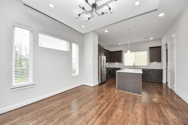 310 Eado Park Cir, Houston, TX 77020 - kitchen featuring freestanding refrigerator, dark brown cabinetry, light countertops, plenty of natural light, and recessed lighting