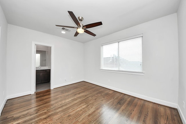 310 Eado Park Cir, Houston, TX 77020 - unfurnished room featuring baseboards, ceiling fan, and dark wood-type flooring