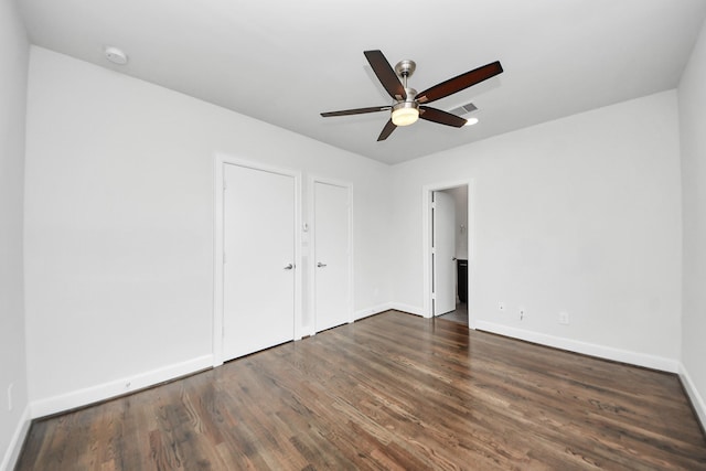 310 Eado Park Cir, Houston, TX 77020 - unfurnished bedroom with baseboards, wood finished floors, and a ceiling fan