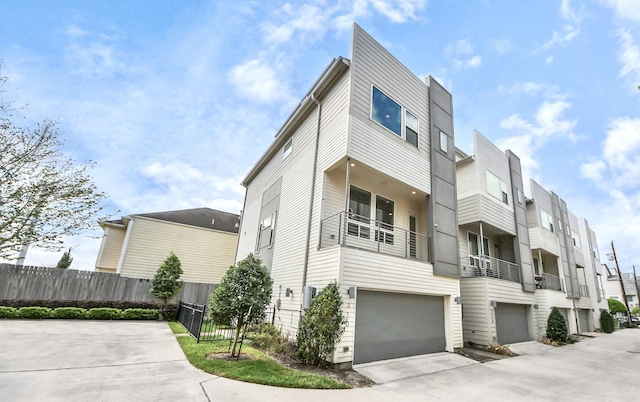 310 Eado Park Cir, Houston, TX 77020 - view of front of property featuring a garage, driveway, and a residential view