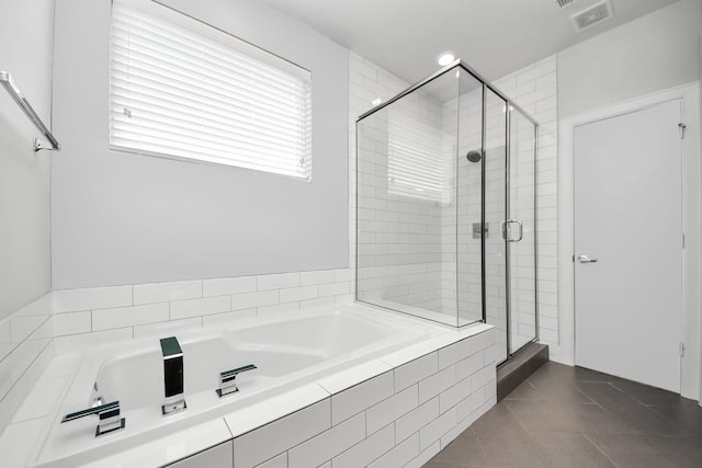 310 Eado Park Cir, Houston, TX 77020 - full bathroom with a garden tub, a stall shower, and tile patterned flooring