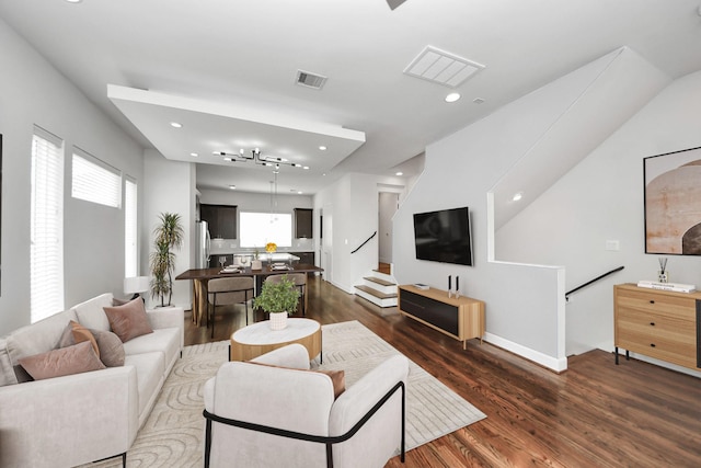 310 Eado Park Cir, Houston, TX 77020 - living area featuring dark wood-style flooring, healthy amount of natural light, recessed lighting, and stairs