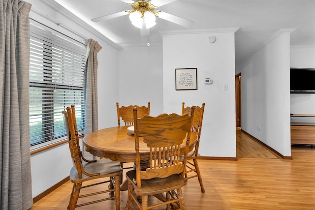 5614 Whipporwill Rd, Conroe, TX 77303 - dining area featuring ornamental molding, ceiling fan, light wood-style floors, and baseboards