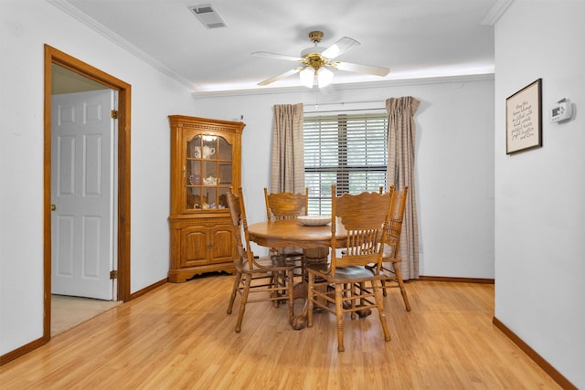 5614 Whipporwill Rd, Conroe, TX 77303 - dining area featuring a ceiling fan, light wood-style flooring, baseboards, and crown molding