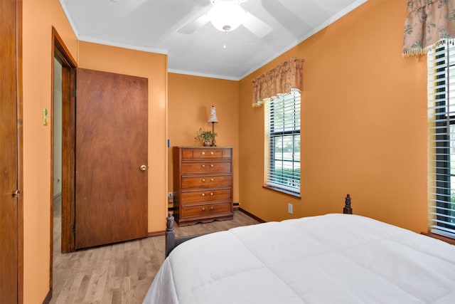 5614 Whipporwill Rd, Conroe, TX 77303 - bedroom featuring wood finished floors, ornamental molding, and ceiling fan