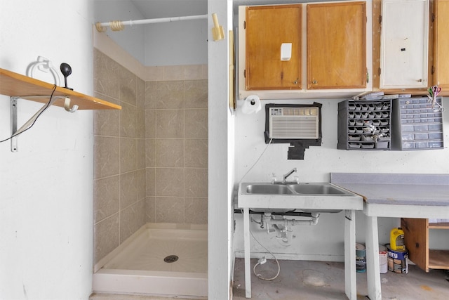 5614 Whipporwill Rd, Conroe, TX 77303 - bathroom with a stall shower, a wall mounted air conditioner, and a sink