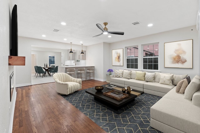 3734 Florinda St, Houston, TX 77021 - living area with dark wood-style flooring, ceiling fan, and recessed lighting