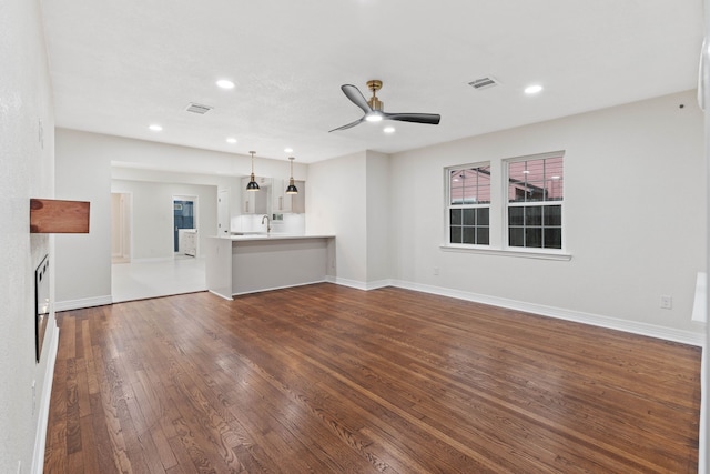 3734 Florinda St, Houston, TX 77021 - unfurnished living room featuring dark wood-type flooring, ceiling fan, and recessed lighting