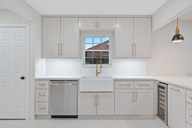 3734 Florinda St, Houston, TX 77021 - kitchen featuring stainless steel dishwasher, beverage cooler, backsplash, light countertops, and decorative light fixtures